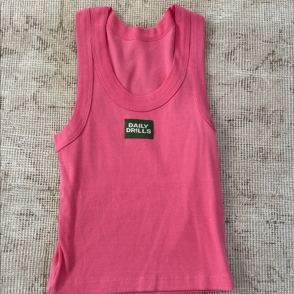 NWT Daily Drills
LOGO RIBBED TANK
Pink
XS/S